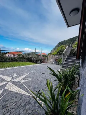 a stone walkway with a white star on it at Adega Do Avô, Madeira Island in Ponta Delgada