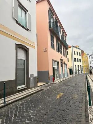 a cobblestone street in a city with buildings at Old Town Charm Apartment Funchal in Funchal