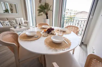a white dining room table with chairs and a window at Old Town Charm Apartment Funchal in Funchal