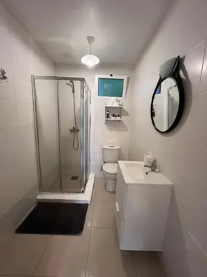 a bathroom with a shower and a toilet and a sink at Latin House in Funchal