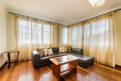 a living room with a couch and a table at Casa da Georgina by GALMI in Arco da Calheta