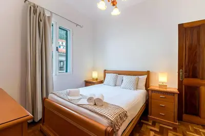 a bedroom with a bed with two towels on it at Casa da Georgina by GALMI in Arco da Calheta