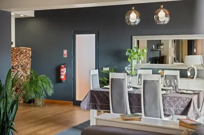 a dining room with a table and a mirror at Quinta do Checa by Homie in Quinta Grande