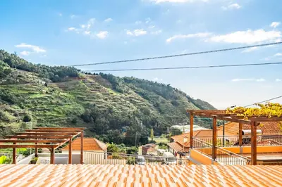 a view of a mountain from the roof of a house at Quinta do Checa by Homie in Quinta Grande
