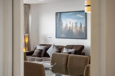 a living room with a couch and a painting on the wall at Ocean Vista- T2 Funchal in Bicas