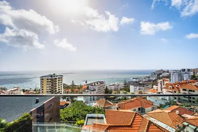 a view of the ocean from the balcony of a building at Ocean Vista- T2 Funchal in Bicas