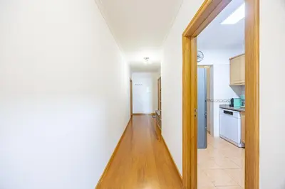 a hallway with a door leading to a kitchen at Ocean Life by YOUR KEY MADEIRA in Caniço