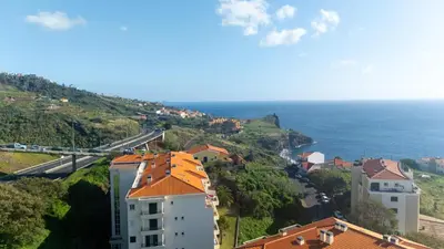 a view of a city and the ocean at Ocean Life by YOUR KEY MADEIRA in Caniço