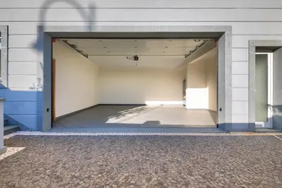 an empty hallway of a building with an open door at Villa Araujo Da Costa by HR Madeira in Caniço