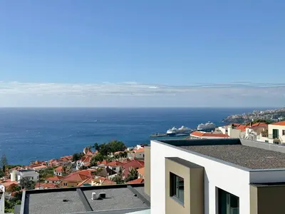 a view of the ocean from a building at Casa do Faial By Madeira Atlantic Escape in Funchal