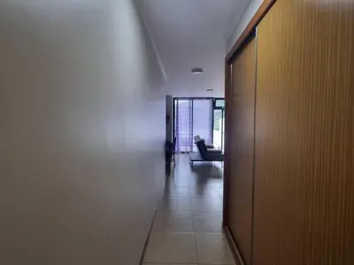 a hallway with a door and a couch in a room at Apto Vista Baía Machico by Susys Holidays in Machico
