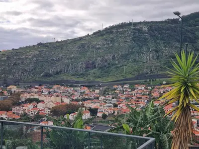 a view of a city with a mountain at Apto Vista Baía Machico by Susys Holidays in Machico