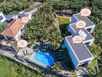 an aerial view of a house with calligraphy at Quinta Golfinho - Casa Nenufar in Arco da Calheta