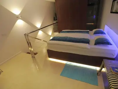 a bedroom with a bed with a glass floor at Quinta Golfinho - Casa Nenufar in Arco da Calheta