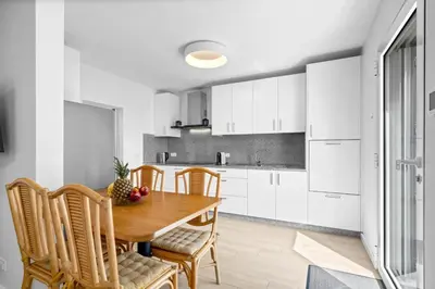 a kitchen with a wooden table and chairs at Casa Do Cabeco in Lapeiras