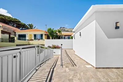 a white house with a white fence at Casa Do Cabeco in Lapeiras