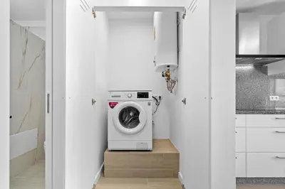 a laundry room with a washer and dryer at Casa Do Cabeco in Lapeiras