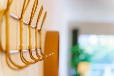 a group of wooden utensils hanging on a wall at GuestReady - A sweet escape in Caniço in Santa Cruz