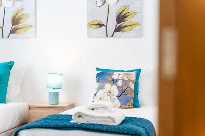 a bedroom with a bed with towels on it at GuestReady - Perfect family home in Caniço in Santa Cruz