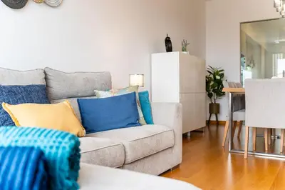 a living room with a couch and a table at GuestReady - Perfect family home in Caniço in Santa Cruz