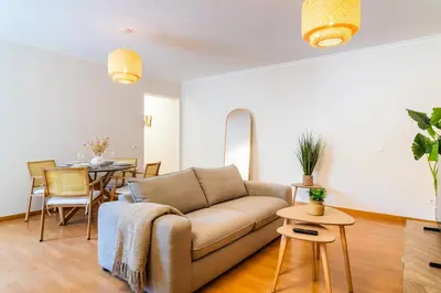 a living room with a couch and a table at GuestReady - The perfect hideout in Caniço in Caniço
