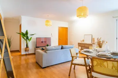 a living room with a couch and a table at GuestReady - The perfect hideout in Caniço in Caniço