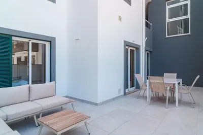 a living room with a couch and a table at GuestReady - The perfect hideout in Caniço in Caniço