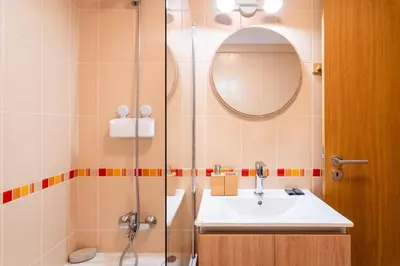 a bathroom with a sink and a shower at GuestReady - The perfect hideout in Caniço in Caniço