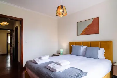 a bedroom with a bed with two towels on it at GuestReady - Lovely experience in Funchal in Funchal
