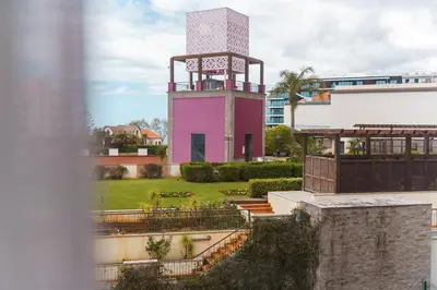 a pink tower in the middle of a building at GuestReady - Lovely experience in Funchal in Funchal