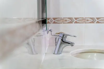 a bathroom with a sink and a faucet at GuestReady - Lovely experience in Funchal in Funchal