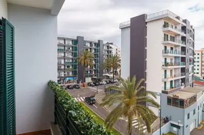 a balcony with a view of a street and buildings at GuestReady - Peaceful haven in Funchal in Funchal