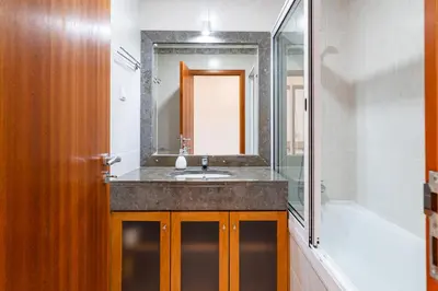 a bathroom with a sink and a shower and a mirror at GuestReady - Peaceful haven in Funchal in Funchal