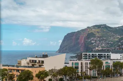 a view of the ocean and a mountain at GuestReady - Peaceful haven in Funchal in Funchal