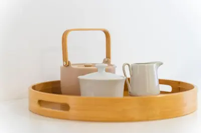 a wooden tray with pots and pans and a mirror at GuestReady - Premium stay in Funchal in Funchal