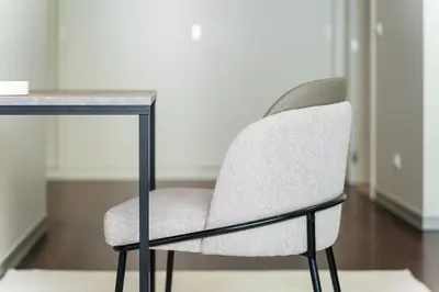 a white chair sitting in front of a desk at GuestReady - Premium stay in Funchal in Funchal