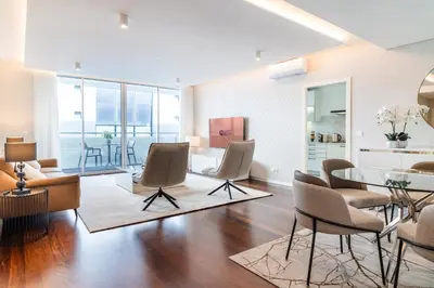 a living room with a table and chairs at GuestReady - Premium stay in Funchal in Funchal