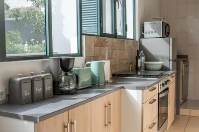 a kitchen with a counter top with a refrigerator at Ferienhaus Treibholz in Funchal