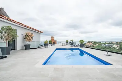 a swimming pool on the roof of a house at Casa Susan in Ribeira Brava