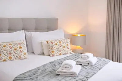 a bed with two towels on top of it at Casa Susan in Ribeira Brava