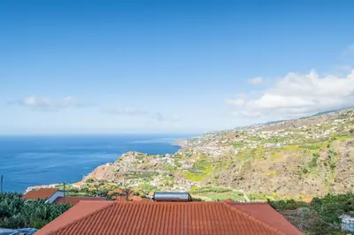 a view of a town on a hill with the ocean at Casa Isabel in Ribeira Brava