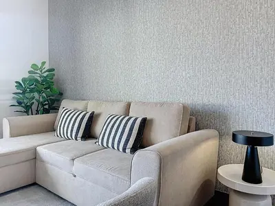 a living room with a couch and a plant at Lido Vista Apartment by Atlantic Holiday in Funchal