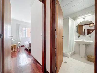 a bathroom with a sink and a mirror at Lido Vista Apartment by Atlantic Holiday in Funchal