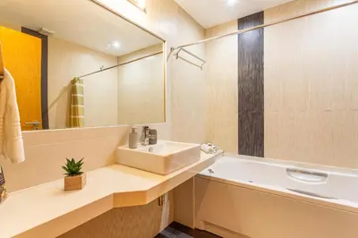 a bathroom with a sink and a mirror at Bianka & Jose Apartment Funchal Madeira in Funchal