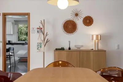 a dining room with a wooden table and chairs at Casa Tabaibo by An Island Apart in Funchal
