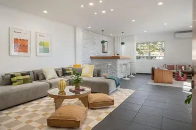 a living room with a couch and a table at Casa Tabaibo by An Island Apart in Funchal