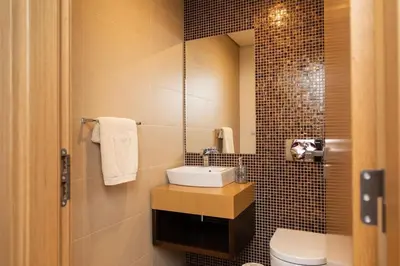a bathroom with a sink and a toilet at October 5th Collection by Rent-a-key in Funchal