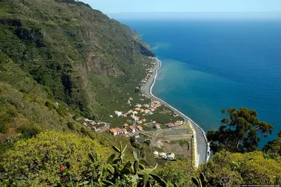 an aerial view of a village on a mountain next to the ocean at Aqua Sea House in Madalena do Mar