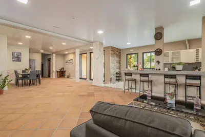 a laundry room with a washer and dryer at Madeira Sunrise Villa in Gaula