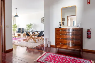 a living room with a dresser and a mirror at Conde Casa Branca by LovelyStay in Funchal